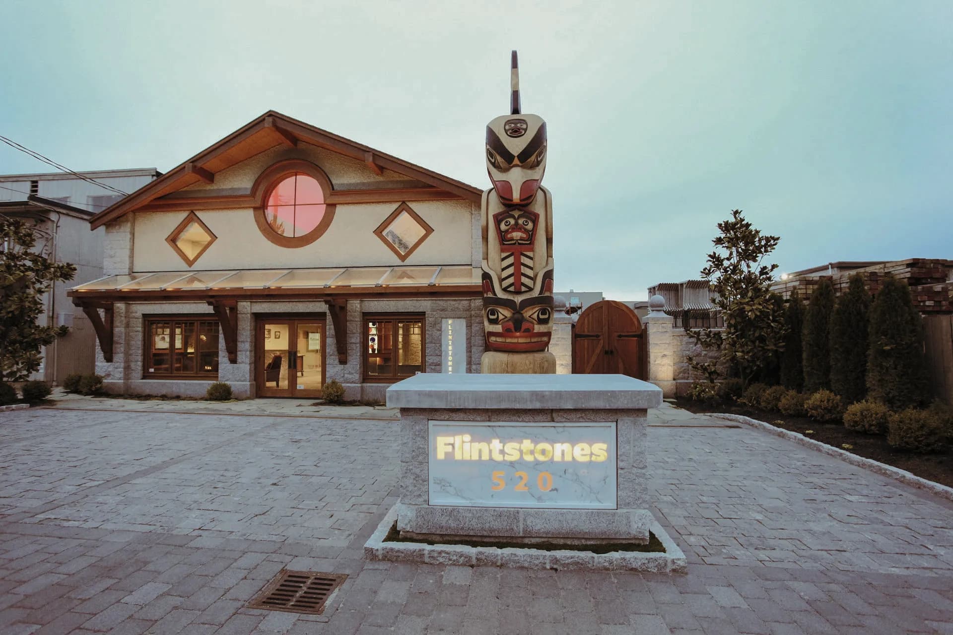 Totem pole at the Flintstones showroom entrance